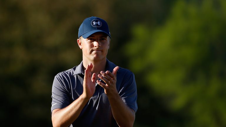 Jordan Spieth applauds the vast galleries after closing out victory over Justin Thomas