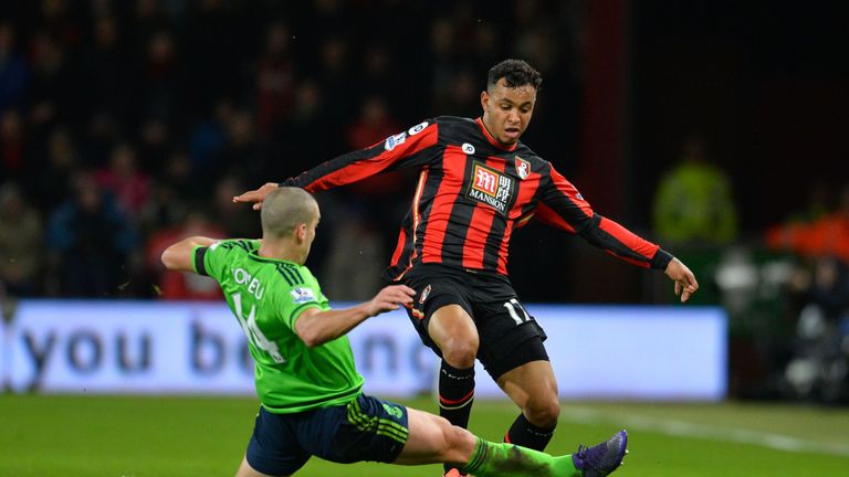 Southampton midfielder Oriol Romeu (L) tackles Bournemouth striker Joshua King (R)