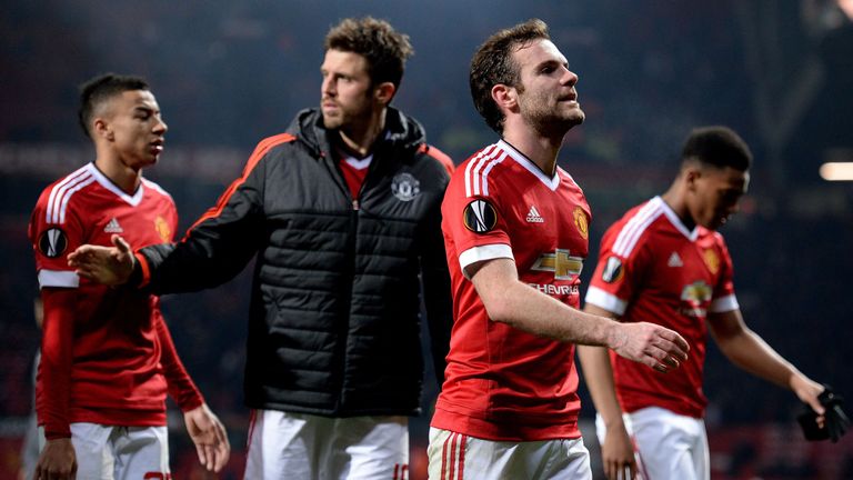 Manchester United'sJuan Mata (2nd R) reacts after the Europa League last-16, second leg between Manchester United and Liverpool at Old Trafford