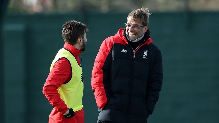 Liverpool manager Jurgen Klopp shares a joke with Adam Lallana