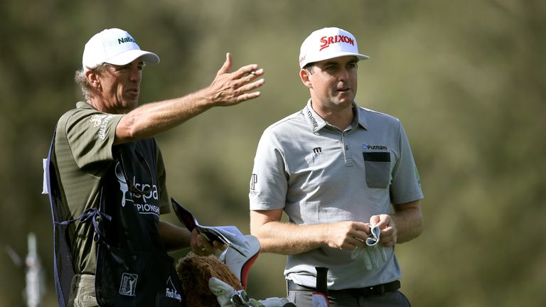 Keegan Bradley and his caddie deal with some testing conditions on day one 