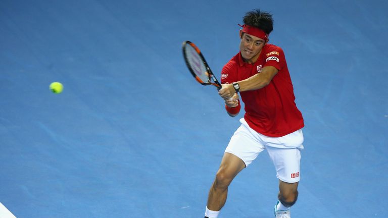 Kei Nishikori of Japan hits a backhand during the singles match against Andy Murray of Great Britain on day three of the Da