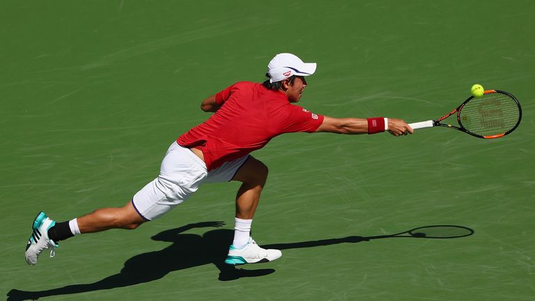 Kei Nishikori of Japan in action against Steve Johnson of USA during day nine of the BNP Paribas Open at Indian Wells Tennis 