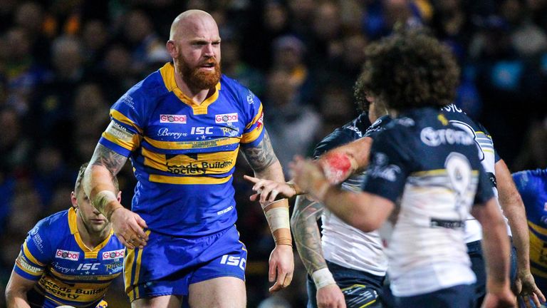  Leeds Rhinos' Keith Galloway clashes with North Queensland Cowboys players.