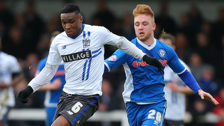 Bury's Kelvin Etuhu wins the ball ahead of Rochdale's Callum Camps during their FA Cup second round match