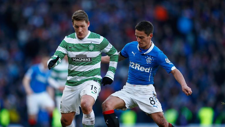 Kris Commons of Celtic is tackled by Ian Black of Rangers  during the Scottish League Cup Semi-Final between Celtic and Rangers in February 2015