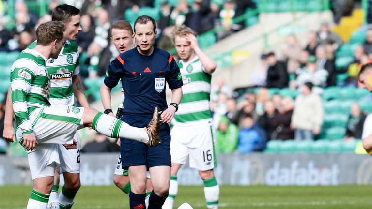 Kris Commons makes his feelings clear to referee Willie Collum after Stefan Johansen was injured