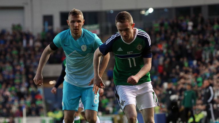 Slovenia's Kurtic Jasmin (left) and Northern Ireland's Shane Ferguson battle for the ball
