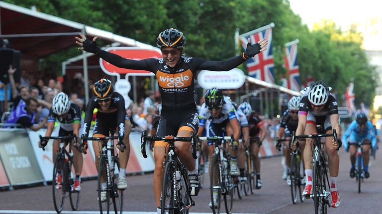 Laura Trott of Great Britain crosses the finish line to win the Pro Women's Grand Prix during the Prudential RideLondon in 2013