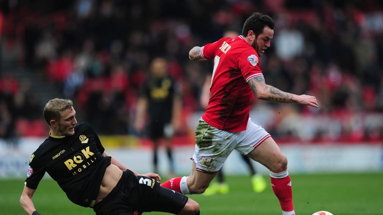 Lee Tomlin is tackled by Dean Moxey 