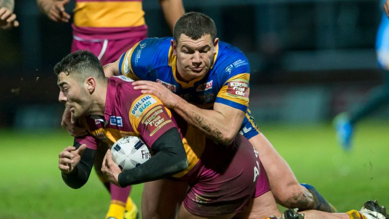 Leeds Rhinos v Huddersfield Giants - Headingley Carnegie Stadium, Leeds, England - Huddersfield's Jake Connor is tackled by Leeds' Brett Ferres.