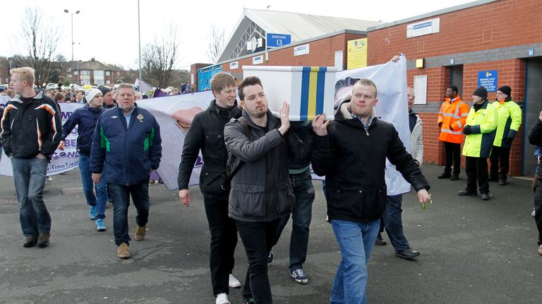 Leeds United fans protesting 'Time To Go Massimo' with coffin