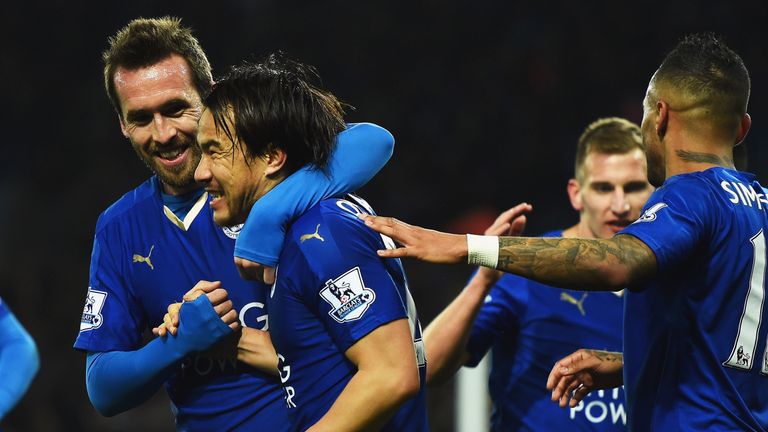 LEICESTER, ENGLAND - MARCH 14:  Shinji Okazaki of Leicester City (2L) celebrates with team mates as he scores their first goal with an overhead kick during