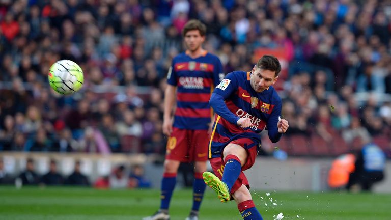 Barcelona's Lionel Messi kicks the ball