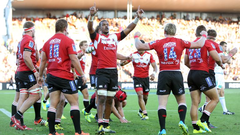 Lions player Fabian Booysen (C) celebrates victory with teammates