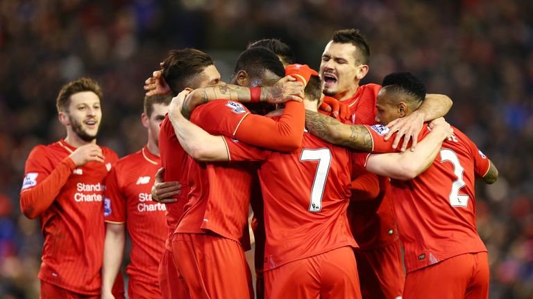 James Milner is mobbed by team-mates after scoring Liverpool's second goal against Manchester City