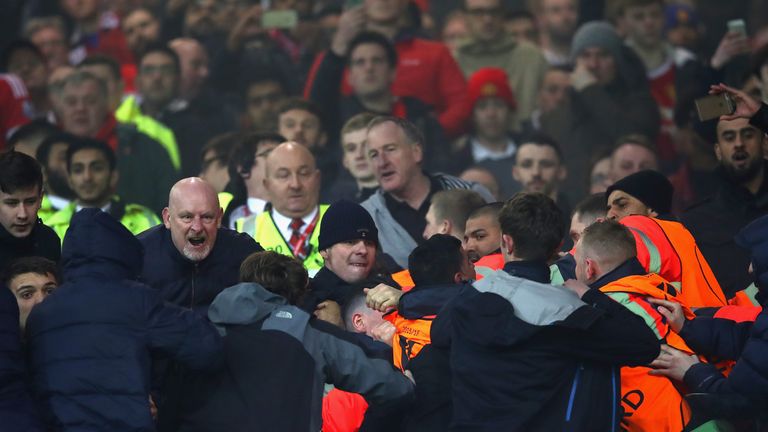 Fans are restrained by stewards