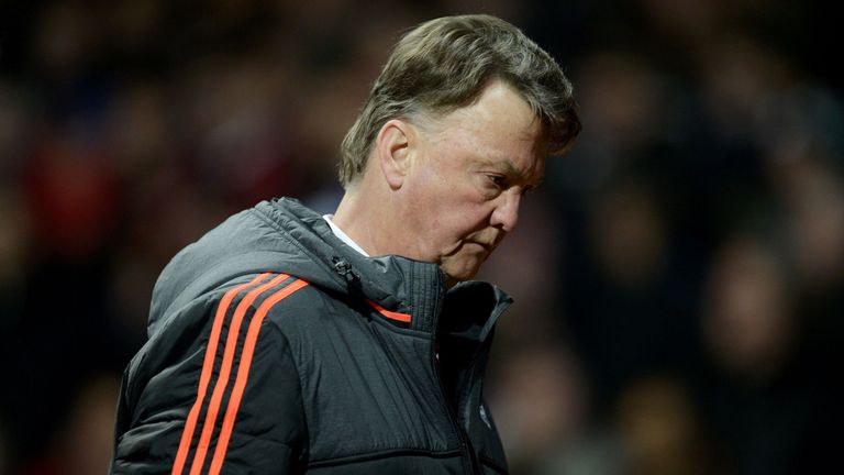 Louis van Gaal leaves at half-time during the UEFA Europa League round of 16, second leg football match between Manchester United and Liverpool