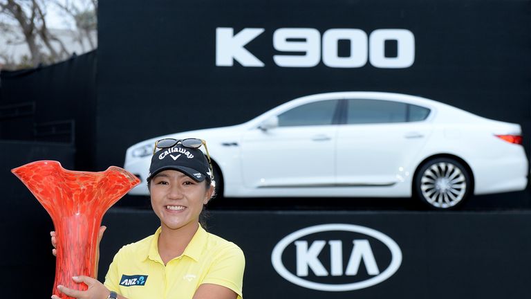 Lydia Ko holds the winners trophy after her victory in the KIA Classic