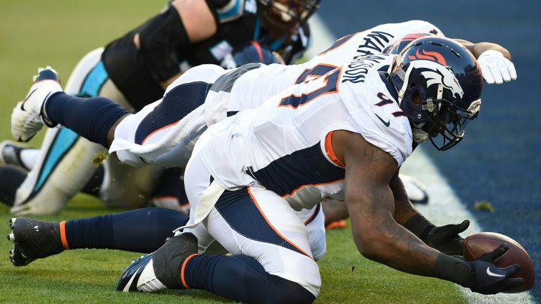 Denver Bronco Malik Jackson reaches for a lose ball in the end zone during Super Bowl 50