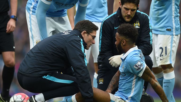 Manchester City's Raheem Sterling receives medical treatment