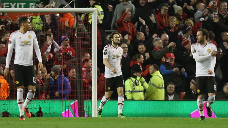 Chris Smalling, Daley Blind and Juan Mata of Manchester United react to Daniel Sturridge of Liverpool scoring their first goal during the Europa League