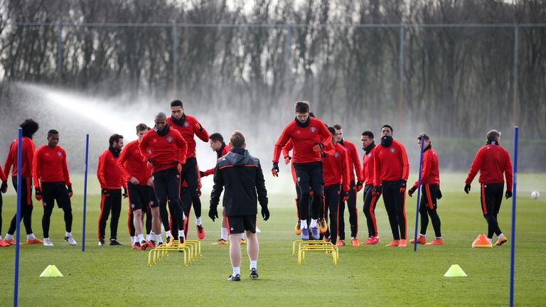 A general view as the Manchester United players warm up during a training session ahead of the Europa League round of 16 second leg match with Liverpool