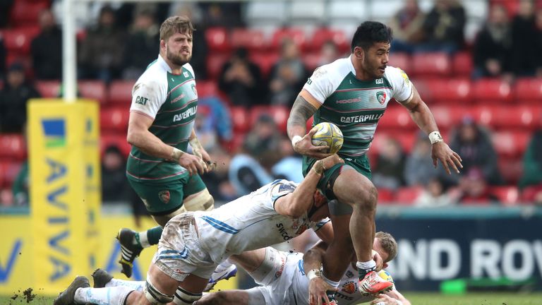 Manu Tuilagi of Leicester is held by Olliie Atkins during the Aviva Premiership match between Leicester Tigers and Exeter Chiefs at Welford Road