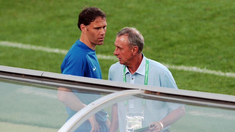 Head coach of the Dutch team Marco Van Basten speaks with former Dutch football legend Johann Cruyff 