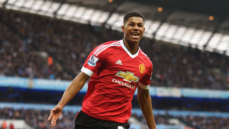 Marcus Rashford of Manchester United celebrates the first goal in the derby