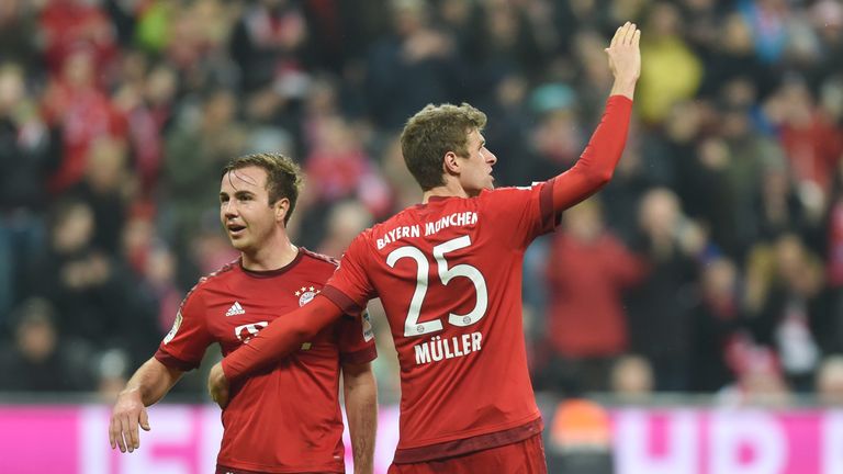 Bayern Munich's midfielder Thomas Mueller (R) celebrates scoring the 2-0 goal with Bayern Munich's midfielder Mario Goetze 