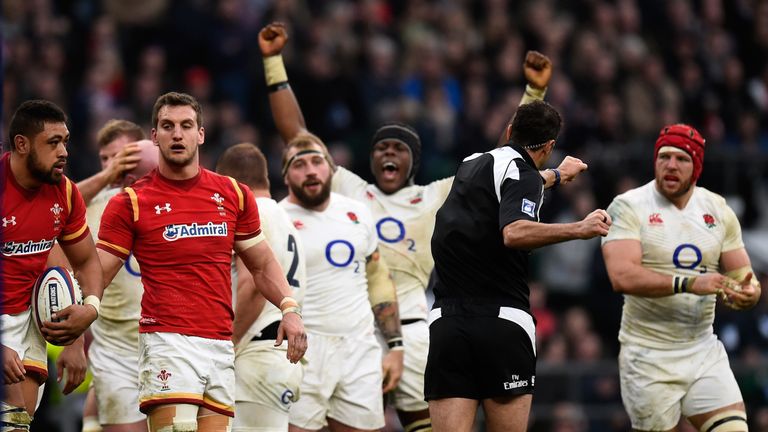 LONDON, ENGLAND - MARCH 12:  Wwales captain Sam Warburton (2nd l) reacts as Maro Itoje celebrates after England win a penalty