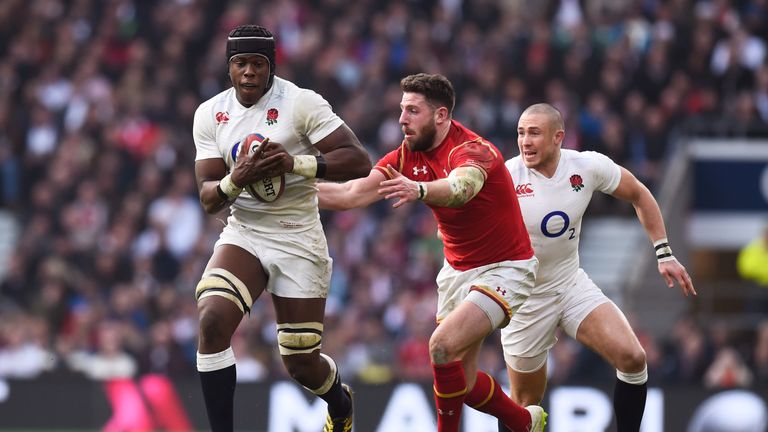 Maro Itoje of England goes past Alex Cuthbert of Wales during the RBS Six Nations