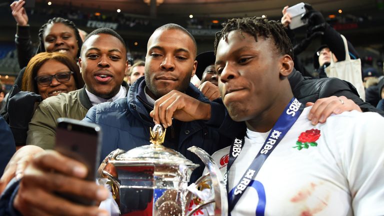 Maro Itoje of England celebrates with the Six Nations trophy