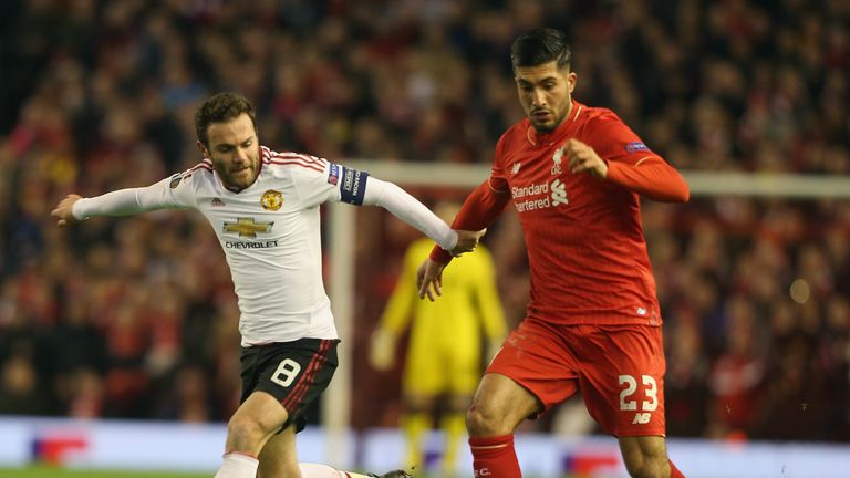 Juan Mata in action with Emre Can of Liverpool during the UEFA Europa League round of 16 first leg match between Liverpool and Manchester United