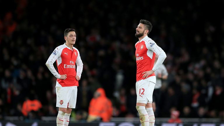 Arsenal's Mesut Ozil and Olivier Giroud (right) stand dejected