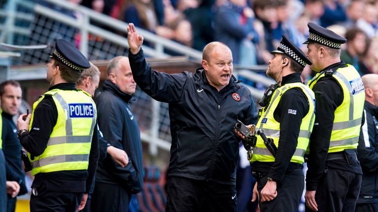 Police speak to Dundee United manager Mixu Paatelainen after his side's equaliser
