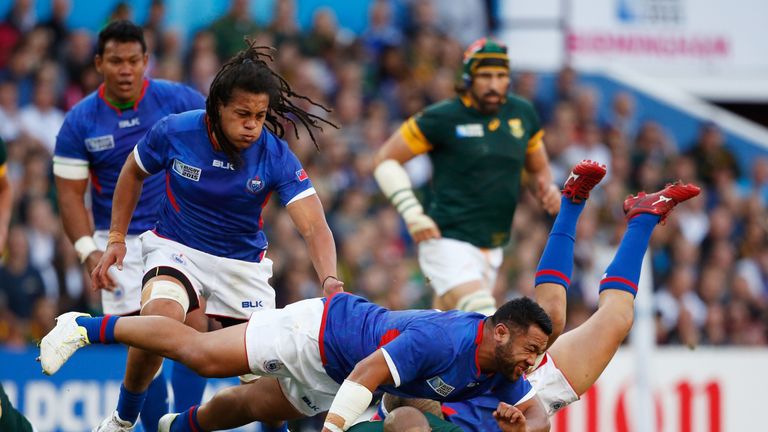 BIRMINGHAM, ENGLAND - SEPTEMBER 26:  JP Pietersen of South Africa is tackled by Motu Matu'u of Samoa during the 2015 Rugby World Cup Pool B match between S