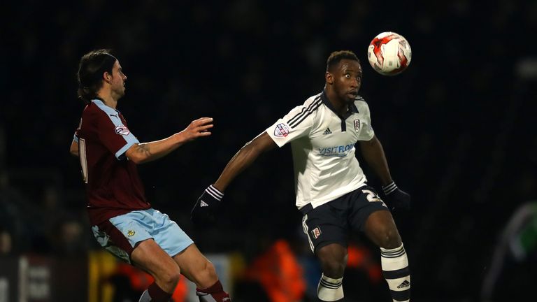 Moussa Dembele keeps the ball away from George Boyd 