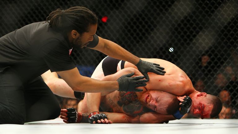 Nate Diaz applies a chokehold to win by submission against Conor McGregor during UFC 196 at the MGM Grand Garden Arena on March 