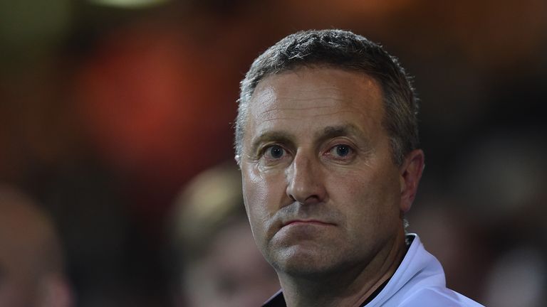 Neil Adams of Norwich City looks on