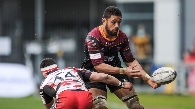 Guinness PRO12, Newport Gwent Dragons vs Edinburgh.Dragons' Taulupe Faletau offloads before the tackle of Edinburgh's Damien Hoyland.