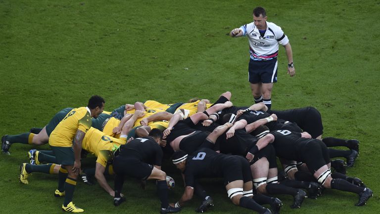 Welsh referee Nigel Owens (Top) supervises a scrum during the final match of the 2015 Rugby World Cup between New Zealand and Australia at Twickenham