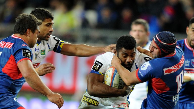 Clermont's Noa Nakaitaci vies with opponents during the French Top 14 match Grenoble v Clermont Auvergne at the Stade des Alpes in Grenoble.