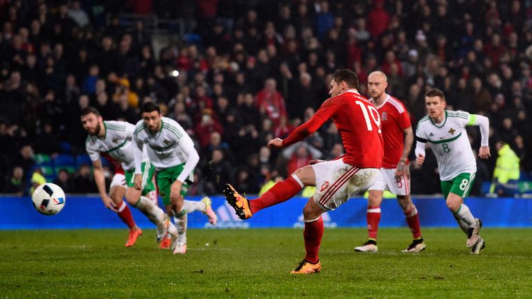 Simon Church scores a penalty for Wales against Northern Ireland