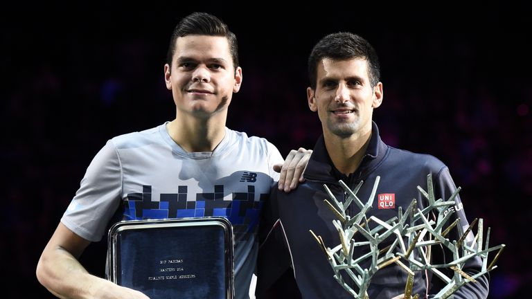 Serbia's Novak Djokovic and Canada's Milos Raonic pose with their trophies after Djokovic won the final match at the ATP World Tour Masters 1000