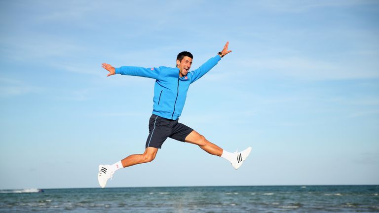 Novak Djokovic of Serbia leaps in the air on Crandon Park