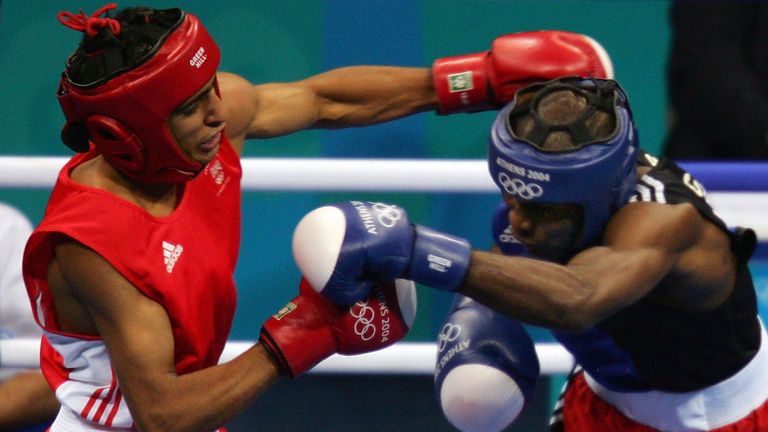 Amir Khan (L) of Great Britain and Mario Cesar Kindelan Mesa of Cuba (Blue) trade puches during the men's boxing 60 kg final bout on A