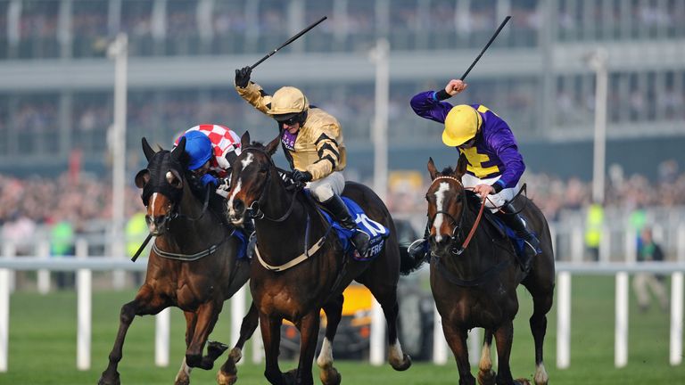 Davy Russell on Lord Windermere (R) won from David Casey on On His Own (centre) in the 2014 Gold Cup