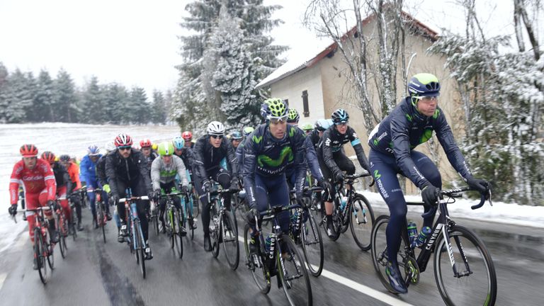 Pack rides under the snow during the third stage of the 74th edition of the Paris-Nice 